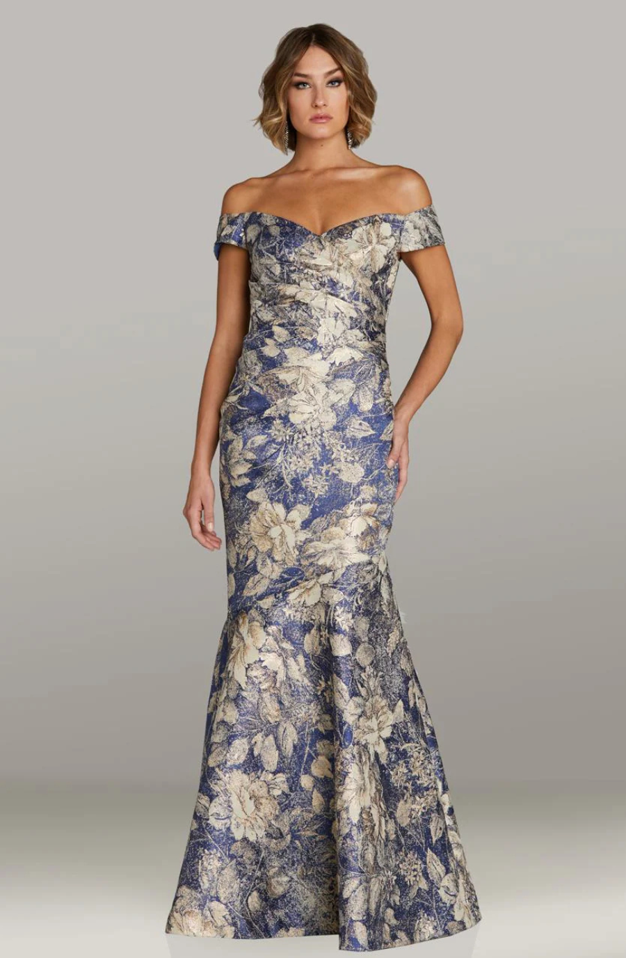 model is wearing an off the shoulder floral print mother of the bride dress