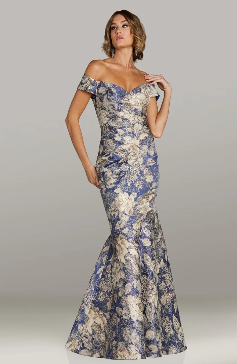 model is wearing an off the shoulder floral print mother of the bride dress