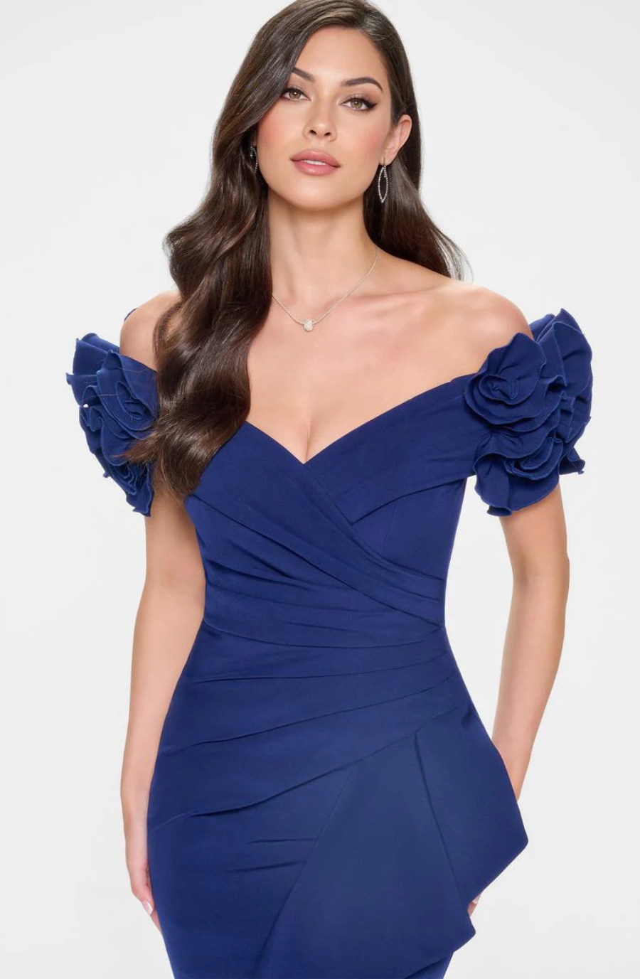 model is wearing a navy off the shoulder mother of the bride dress