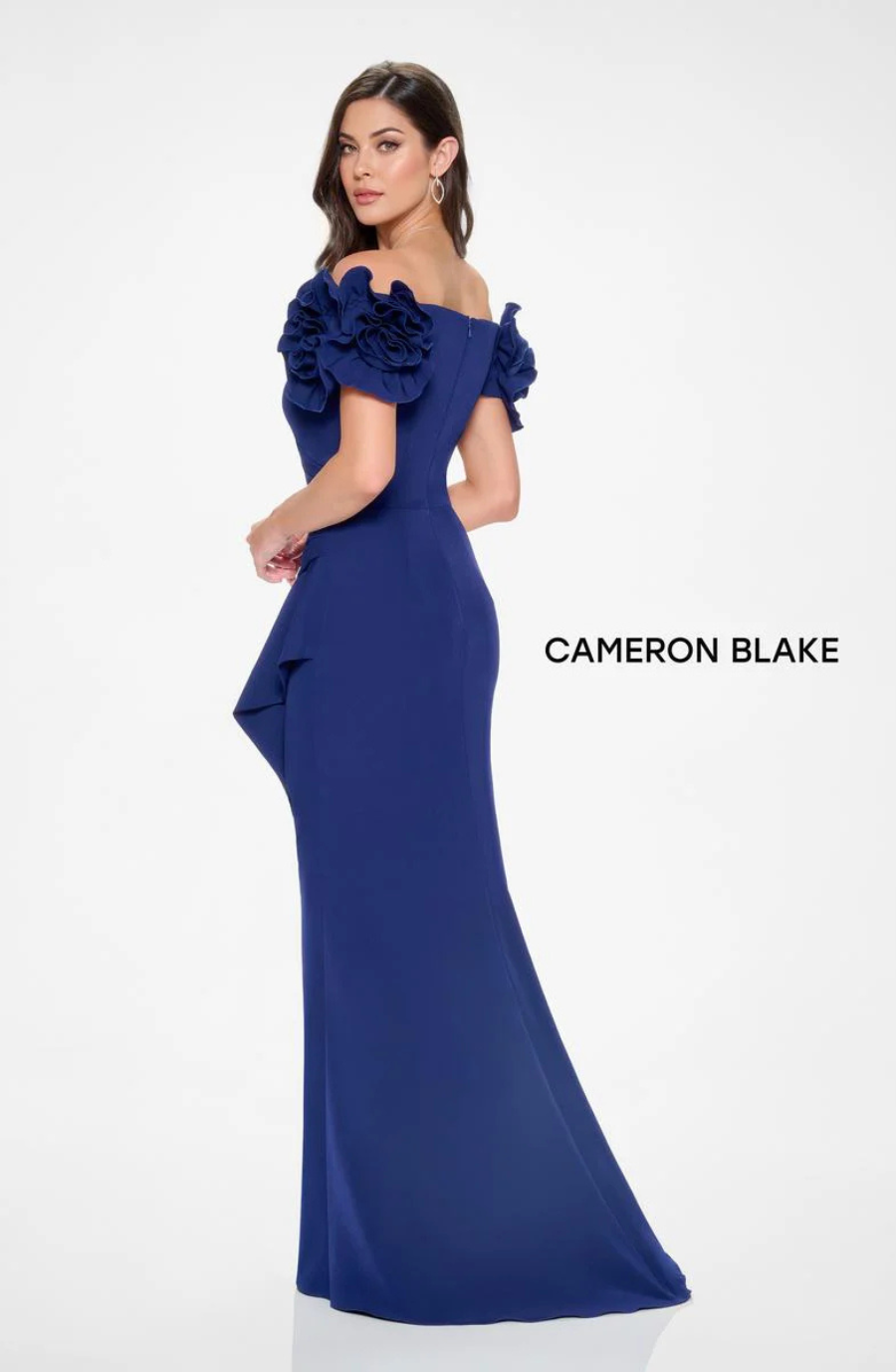 model is wearing a navy off the shoulder mother of the bride dress
