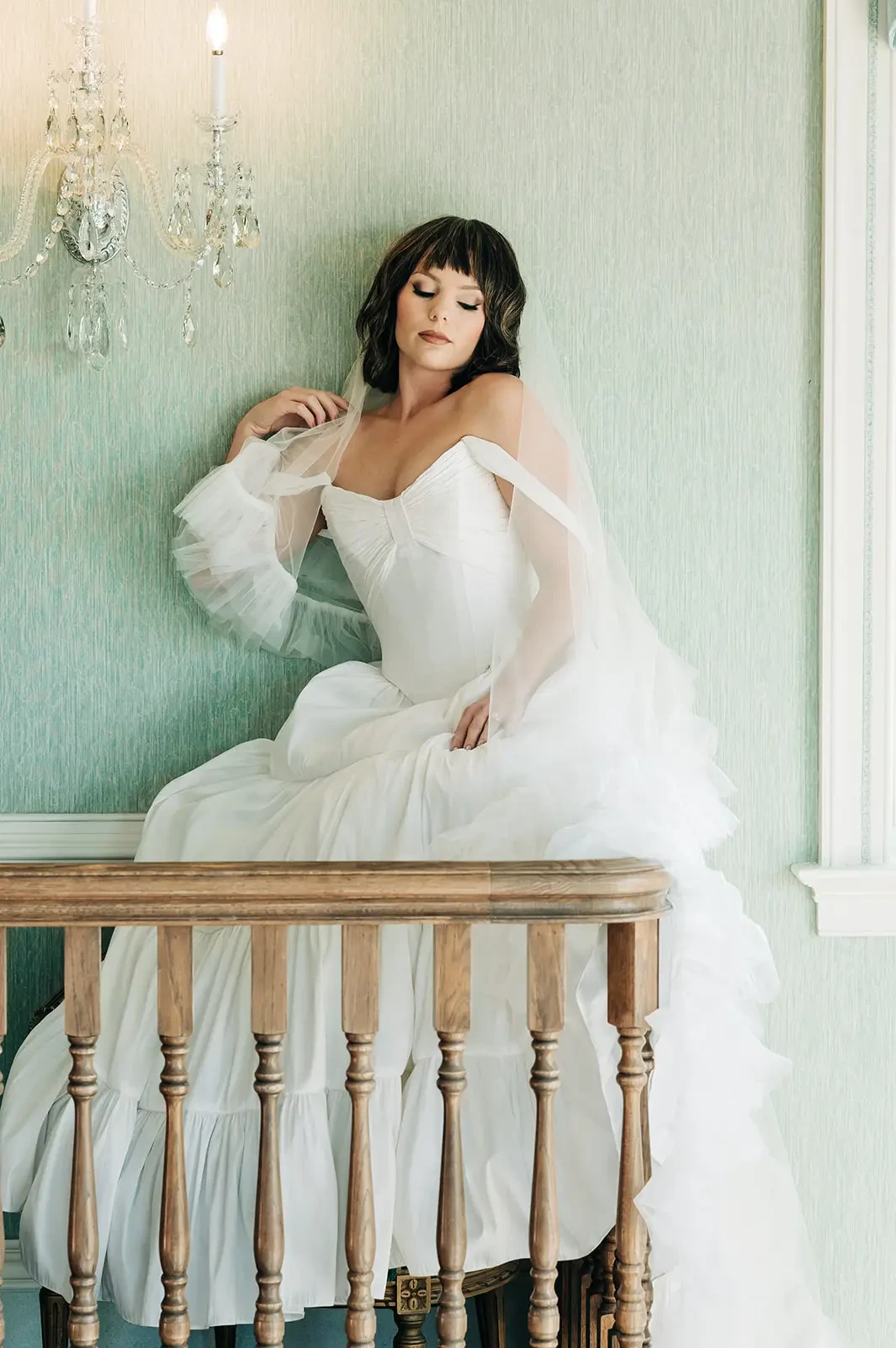 image shows a model wearing a custom wedding dress