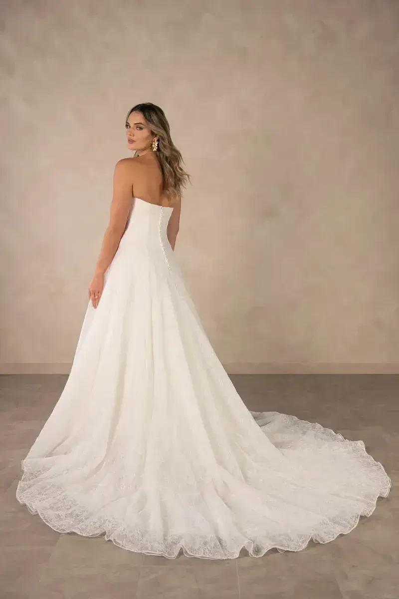 model is wearing a strapless a-line bridal gown
