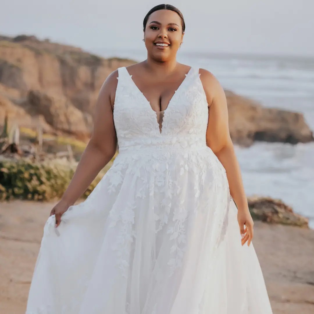 Model wearing plus size dress