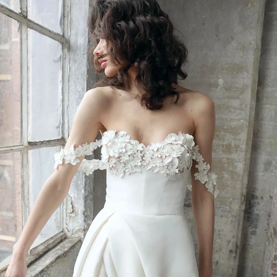 Model wearing white ballgown dress