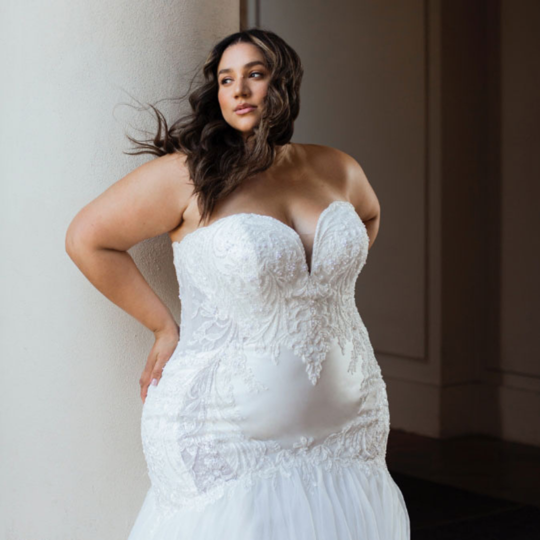 Model wearing white mermaid dress