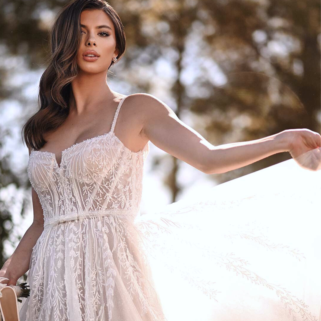 Model wearing white ballgown dress