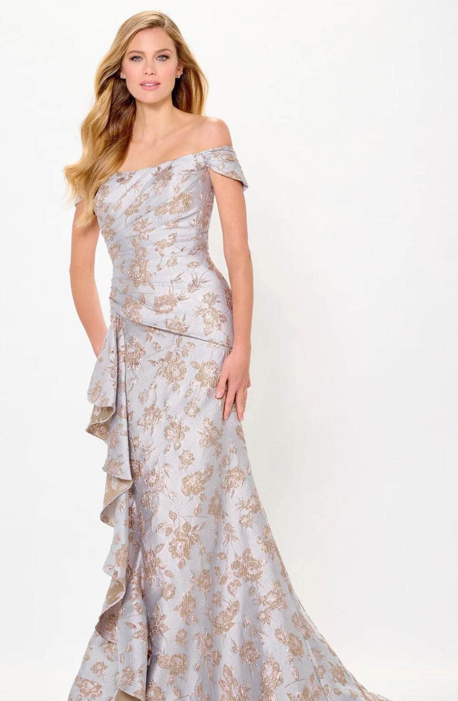 model is wearing a light pink floral off the shoulder mother of the bride dress