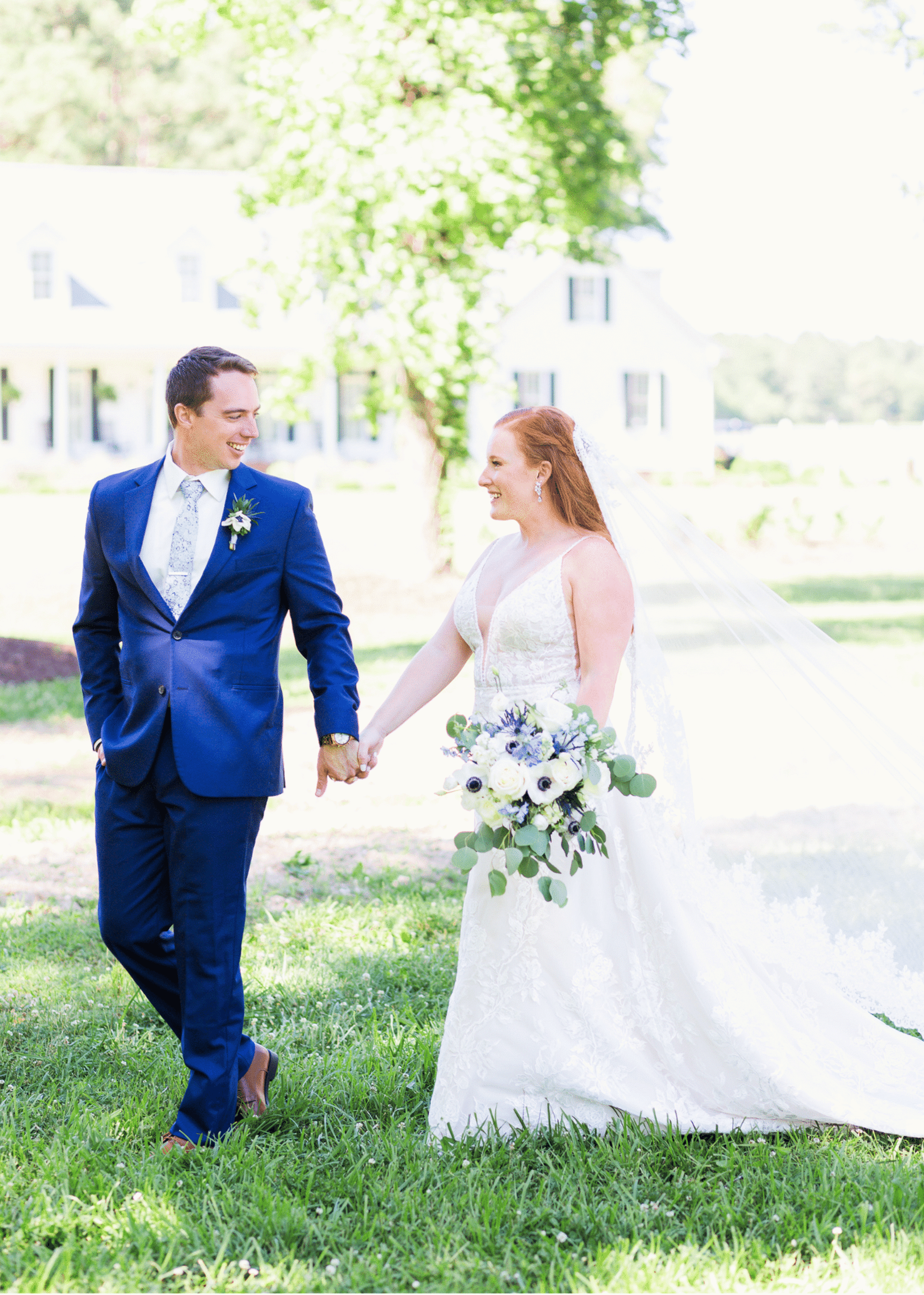 Сouple wearing a white gown and a Blue suit