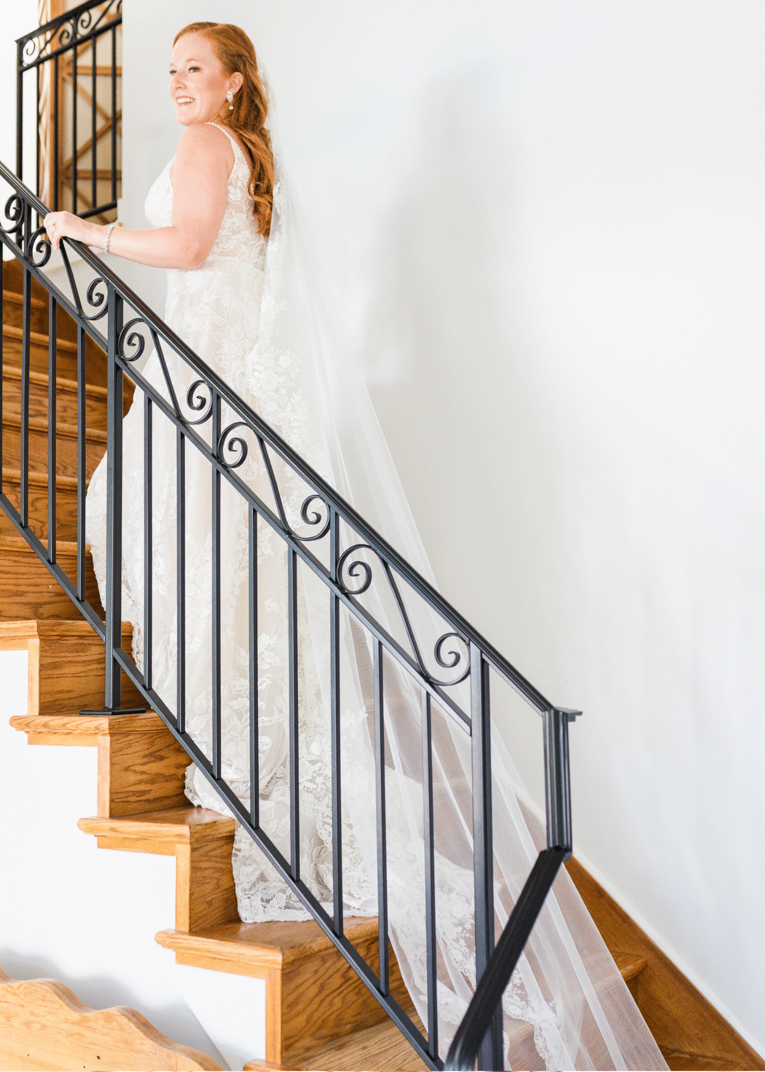 Model wearing a white gown on the stairs