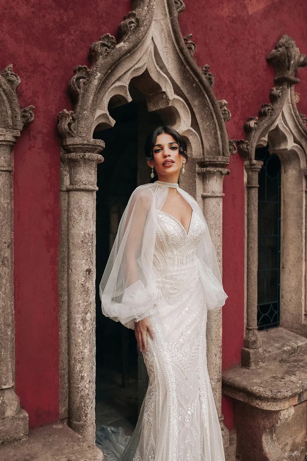 Model wearing a white gown on the stairs