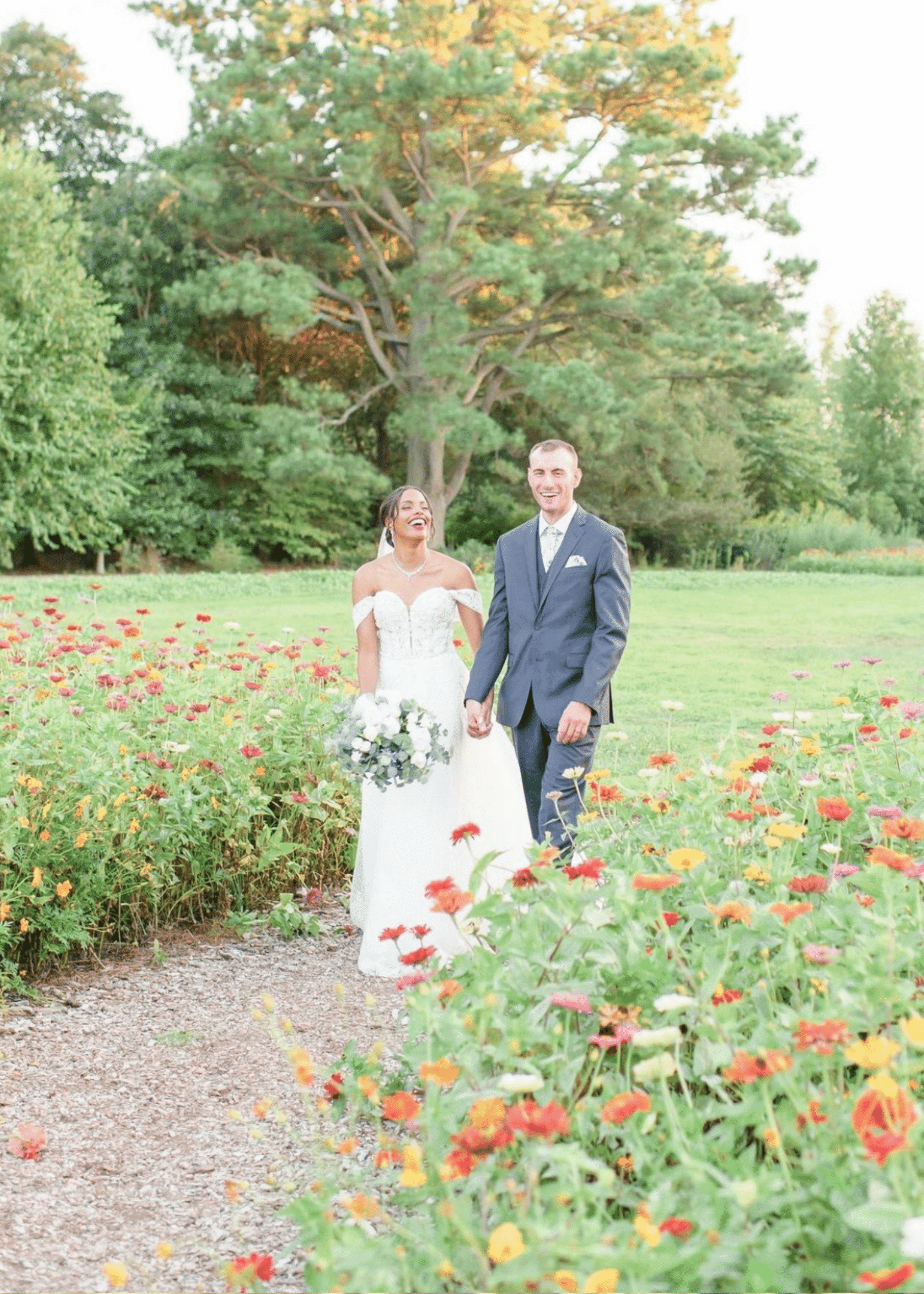 Сouple wearing a white gown and a gray suit