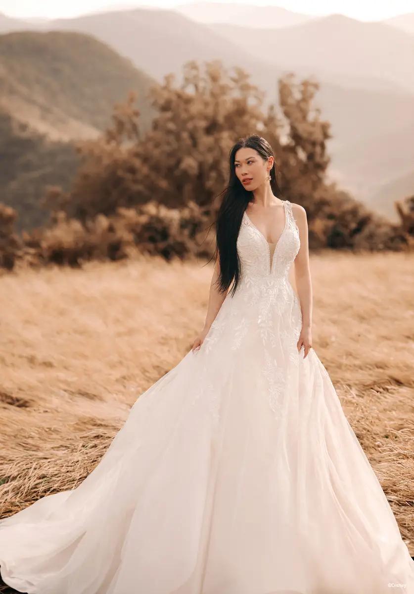 Model wearing a white gown in a field
