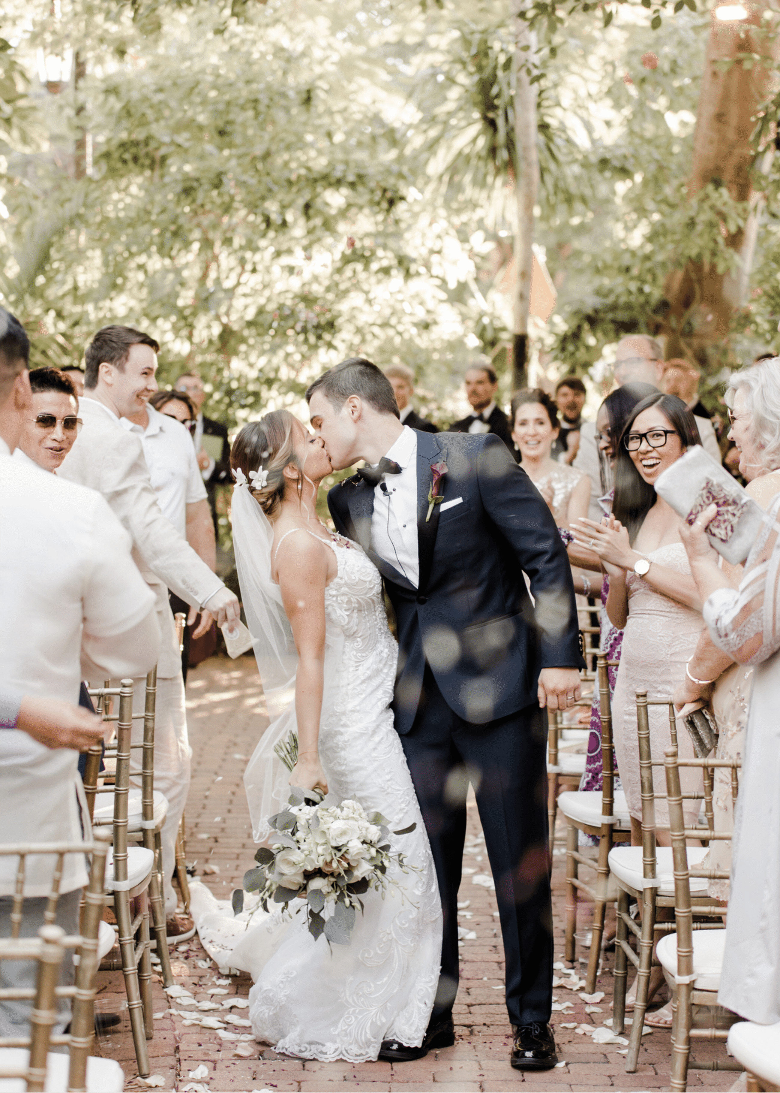 Сouple wearing a white gown and a black suit 2