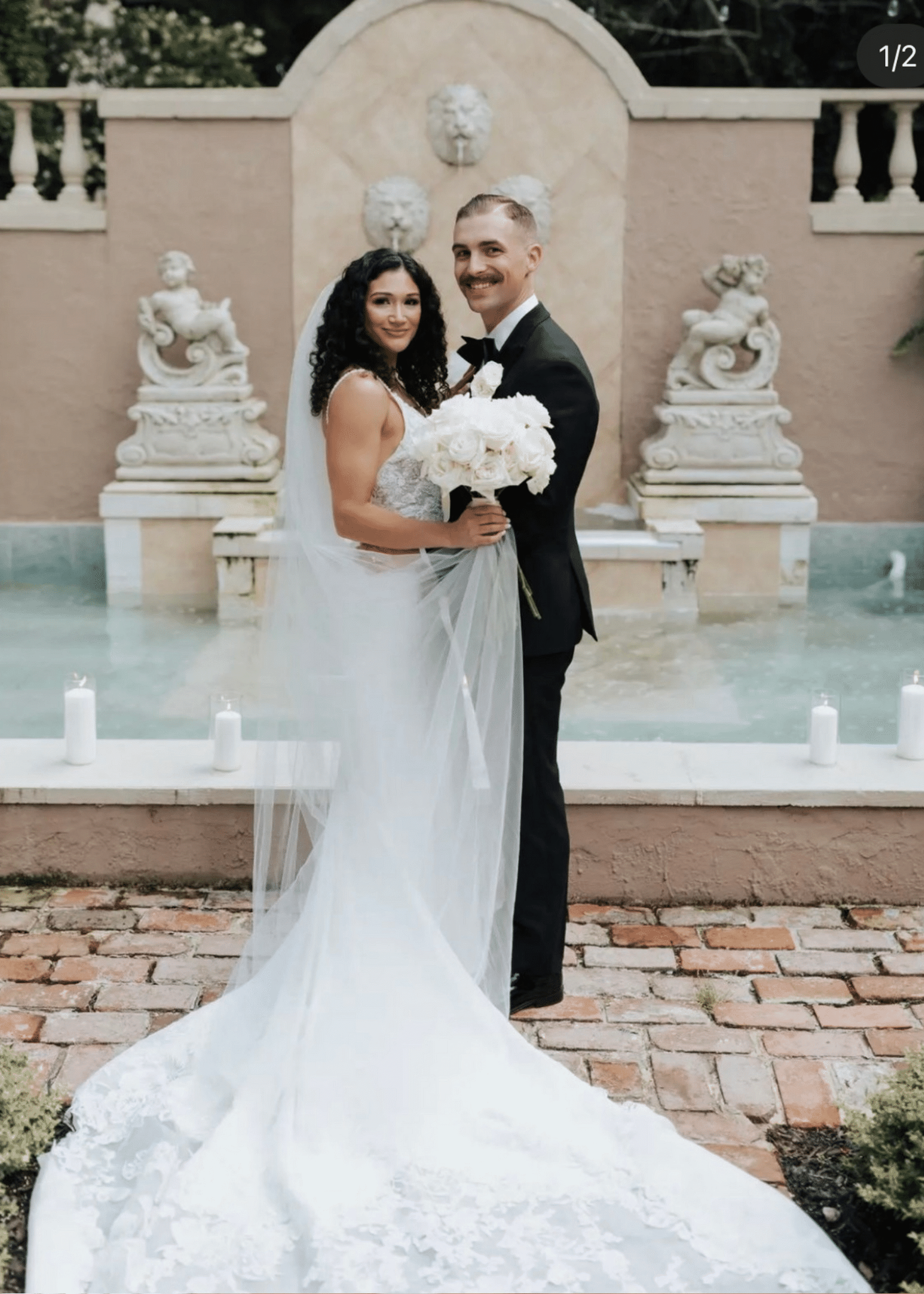 Сouple wearing a white gown and a black suit