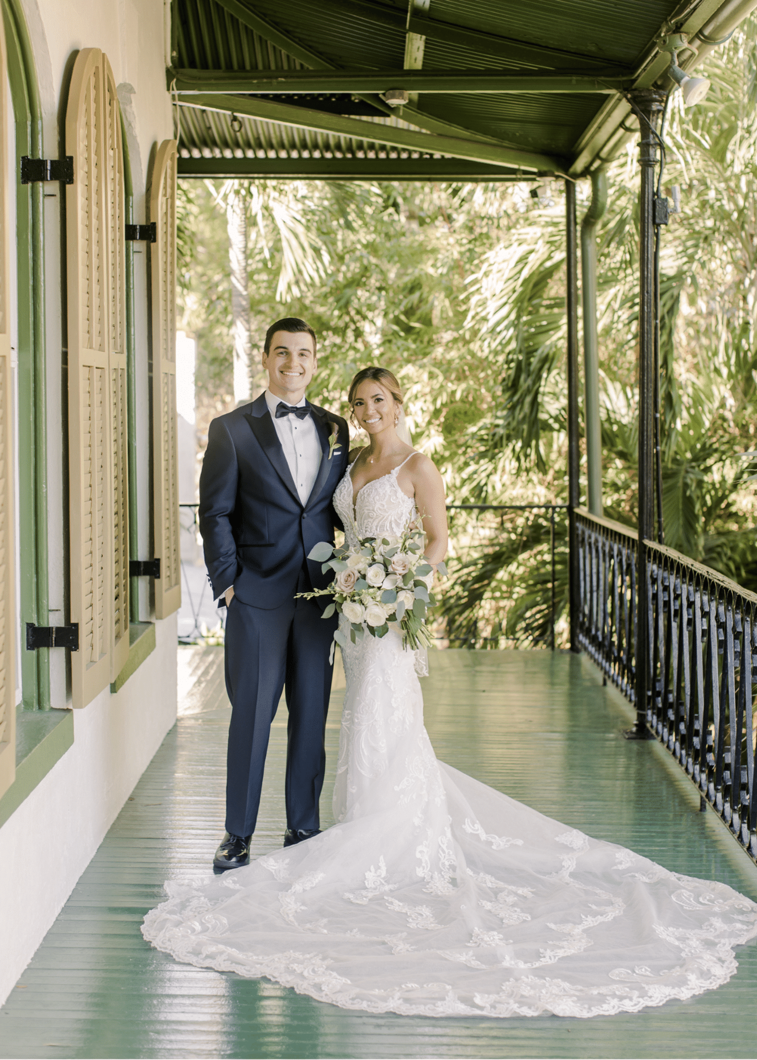 Сouple wearing a white gown and a black suit